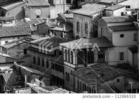 Old residential houses in the city center of Siena, seen from the Facciatone panoramic viewpoint Old residential houses in the city center of Siena, seen from the Facciatone panoramic viewpoint 112866328