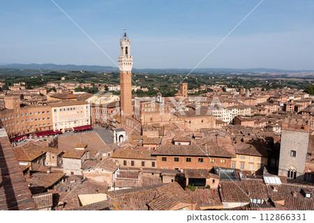 View over the roofs of Siena towards the Torre Magna, seen from the roof of the Siena cathedral View over the roofs of Siena towards the Torre Magna, seen from the roof of the Siena cathedral 112866331