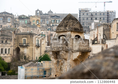 Close view of an old chimney in downtown Matera, Southern Italy Close view of an old chimney in downtown Matera, Southern Italy 112866448