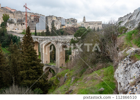 The famous aqueduct bridge from Roman times in Gravina, Italy The famous aqueduct bridge from Roman times in Gravina, Italy 112866510
