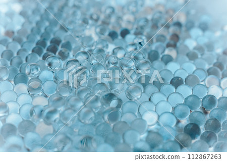 Blue Hydrogel Balls or Aqua Crystal Jelly Soil for Flower or Plant or Home background Blue Hydrogel Balls or Aqua Crystal Jelly Soil for Flower or Plant or Home background 112867263