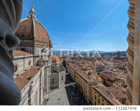 The giant cathedral and cupola of Santa Maria del Fiore cathedral in Florence 112867456