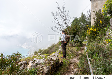 Hiking the famous path Sentiero degli Dei, the path of Gods at the Amalfi coast, Italy Hiking the famous path Sentiero degli Dei, the path of Gods at the Amalfi coast, Italy 112867529