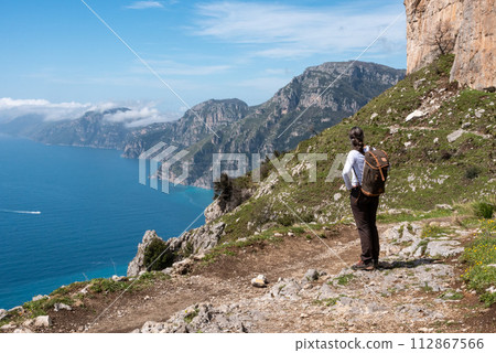 Hiking the famous path Sentiero degli Dei, the path of Gods at the Amalfi coast, Italy Hiking the famous path Sentiero degli Dei, the path of Gods at the Amalfi coast, Italy 112867566