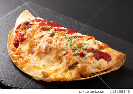 Sausage and potato tortilla grilled with cheese 112868546