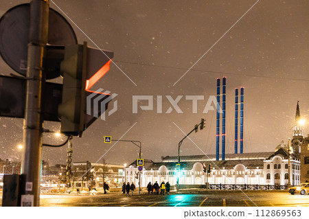 crosswalk in snowfall in Moscow city in evening crosswalk in snowfall in Moscow city in evening 112869563