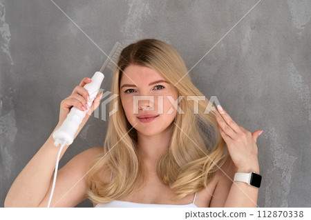 Enjoying microcurrent hair therapy. 112870338