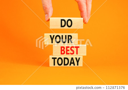 Do your best today symbol. Concept words Do your best today on beautiful wooden block. Beautiful orange table background. Businessman hand. Business motivational do your best today concept. Copy space Do your best today symbol. Concept words Do your best today on beautiful wooden block. Beautiful orange table background. Businessman hand. Business motivational do your best today concept. Copy space 112871376