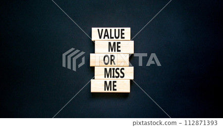 Value or miss me symbol. Concept words Value me or miss me on wooden block. Beautiful black table black background. Business psychological and value or miss me concept. Copy space. Value or miss me symbol. Concept words Value me or miss me on wooden block. Beautiful black table black background. Business psychological and value or miss me concept. Copy space. 112871393