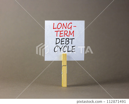 Long-term debt cycle symbol. Concept words Long-term debt cycle on beautiful white paper on clothespin. Beautiful grey background. Business Long-term debt cycle concept. Copy space. Long-term debt cycle symbol. Concept words Long-term debt cycle on beautiful white paper on clothespin. Beautiful grey background. Business Long-term debt cycle concept. Copy space. 112871491