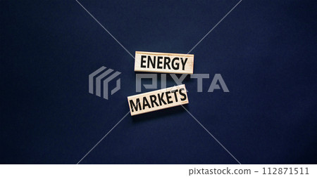 Energy markets symbol. Concept words Energy markets on wooden block. Beautiful black table black background. Business energy markets concept. Copy space. Energy markets symbol. Concept words Energy markets on wooden block. Beautiful black table black background. Business energy markets concept. Copy space. 112871511