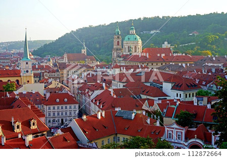 PRAGUE, CZECH REPUBLIC red roof of Prague Castle. Old town of Prague. Prague panorama landscape view with red roofs. Prague view from Petrin Hill, Prague, Czechia. PRAGUE, CZECH REPUBLIC red roof of Prague Castle. Old town of Prague. Prague panorama landscape view with red roofs. Prague view from Petrin Hill, Prague, Czechia. 112872664