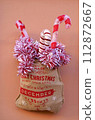 Christmas street decor. Christmas balls on tree branches on winter city streets. Soft focus. Christmas in Europe.Christmas season in Europe. Winter holiday decor 112872667