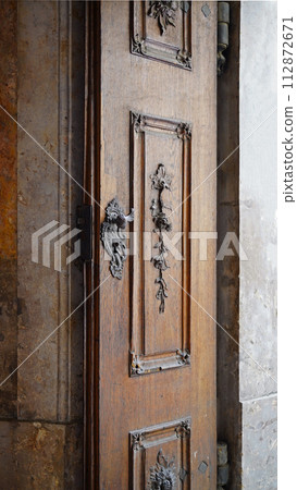 Doors of Vienna. Austria. Classic old wooden door in a public place on a city street or in an urban environment 112872671