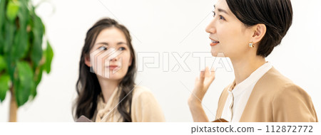 Business woman listening to a presentation 112872772