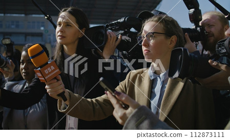 Organization representative answering press questions Organization representative answering press questions 112873111