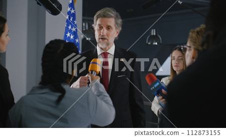 Serious American politician answers journalists questions 112873155