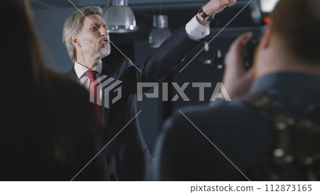 Politician comes on press conference with news journalists 112873165