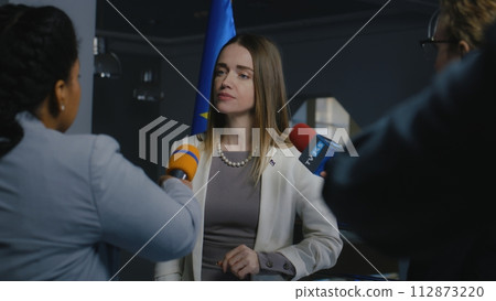 European female politician gives interview for media 112873220