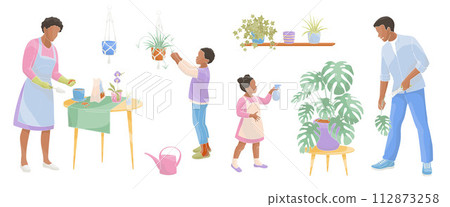 smiling parents with children care for house plants African American Family working together 112873258