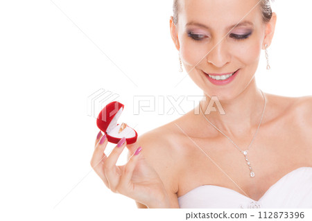 Excited bride woman opening engagement ring box. Excited bride woman opening engagement ring box. 112873396