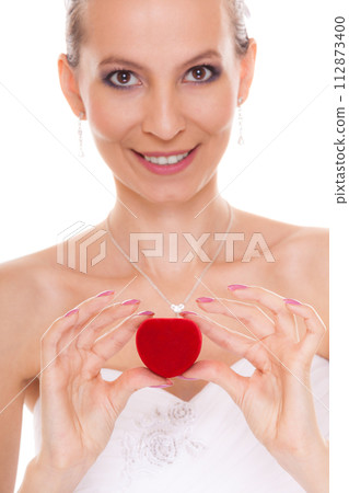 Excited bride woman showing engagement ring box. Excited bride woman showing engagement ring box. 112873400