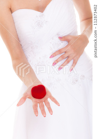 Engagement ring box in woman bride hands. 112873402