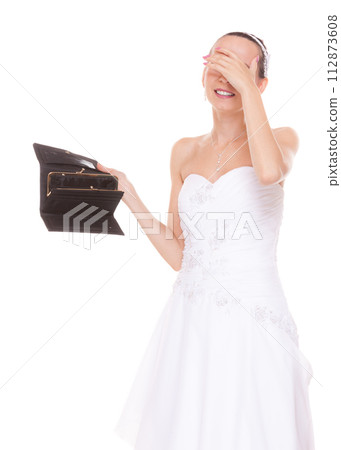 Worried bride with empty wallet. Wedding expenses. 112873608