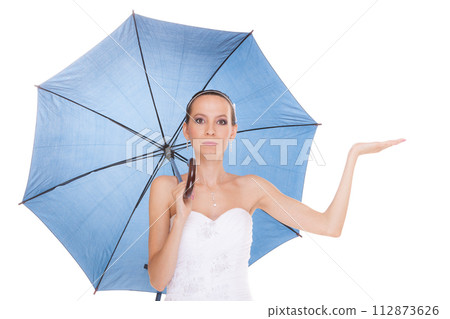 Pretty bride woman in white dress holding umbrella 112873626
