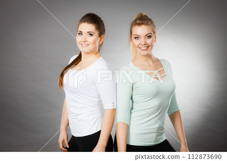 Two happy women friends having fun 112873690