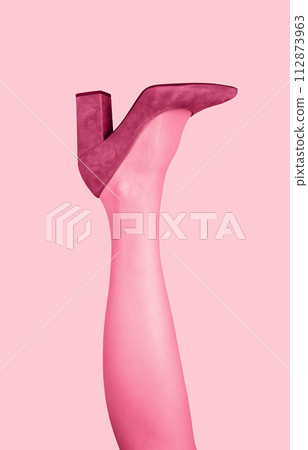Pink shoe, heeled footwear on women leg raised up. Female foot wear. Funny sexy photo Pink shoe, heeled footwear on women leg raised up. Female foot wear. Funny sexy photo 112873963