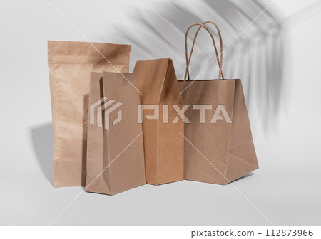 Kraft paper bag, pouch, sack, box. Brown beige eco package, packs for product, gifts Kraft paper bag, pouch, sack, box. Brown beige eco package, packs for product, gifts 112873966