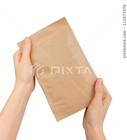Hand holding ziplock paper bag. Zip-lock pouch, kraft eco package 112873976