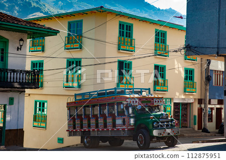 Colorful traditional rural bus from Colombia called chiva at the central square of the small town of Pacora in Colombia Colorful traditional rural bus from Colombia called chiva at the central square of the small town of Pacora in Colombia 112875951