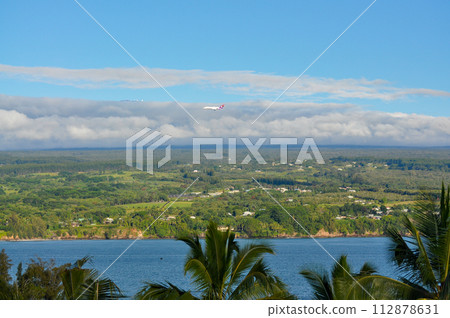 Airplane flying over Hawaii Island Airplane flying over Hawaii Island 112878631