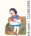 Girl sitting on the sofa and looking to the side 112881890