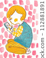 A child engrossed in his smartphone 112881891