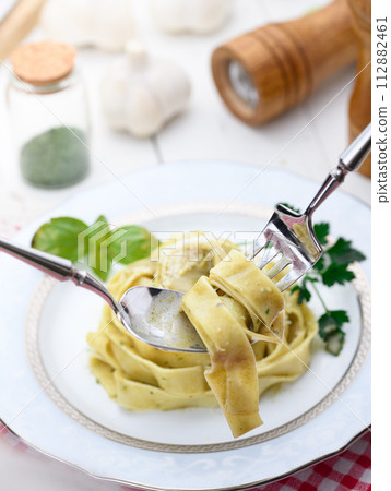 Genovese fettuccine bright pasta with basil Genovese fettuccine bright pasta with basil 112882461