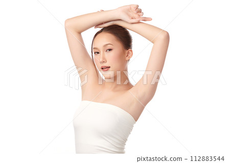 Beautiful Young Asian woman lifting hands up to show off clean and hygienic armpits or underarms on white background, Smooth armpit cleanliness and protection concept 112883544