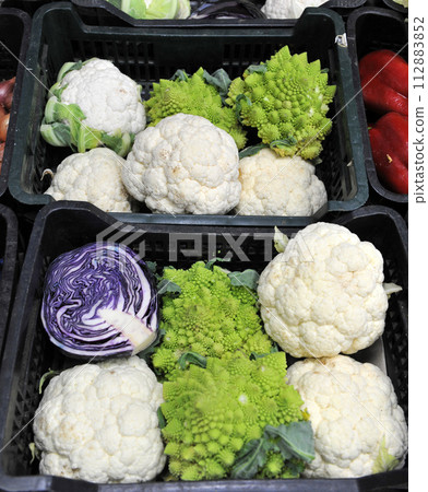 different cabbages in a store 112883852