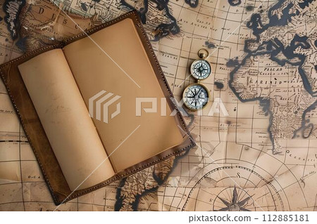 Vintage compass and old map on old paper background on table, travel concept Vintage compass and old map on old paper background on table, travel concept 112885181