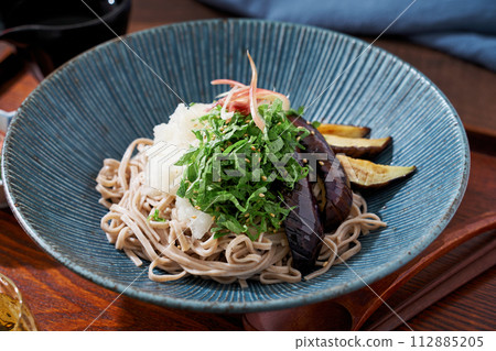 Cold soba noodles with fried eggplant, shiso leaves, and grated radish Cold soba noodles with fried eggplant, shiso leaves, and grated radish 112885205