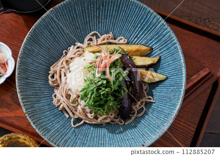 Cold soba noodles with fried eggplant, shiso leaves, and grated radish Cold soba noodles with fried eggplant, shiso leaves, and grated radish 112885207