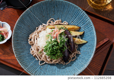 Cold soba noodles with fried eggplant, shiso leaves, and grated radish Cold soba noodles with fried eggplant, shiso leaves, and grated radish 112885208