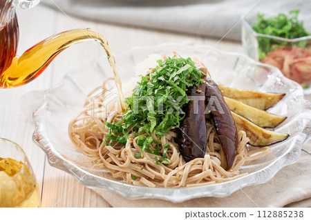 Cold soba noodles with fried eggplant, shiso leaves, and grated radish Cold soba noodles with fried eggplant, shiso leaves, and grated radish 112885238