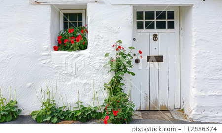 White coastal cottage in the English countryside style by the seaside White coastal cottage in the English countryside style by the seaside 112886374