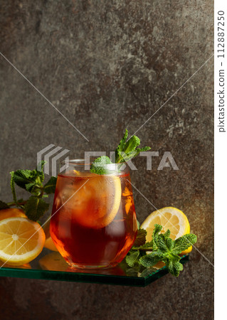 Iced tea with ice, lemon, and mint. Iced tea with ice, lemon, and mint. 112887250