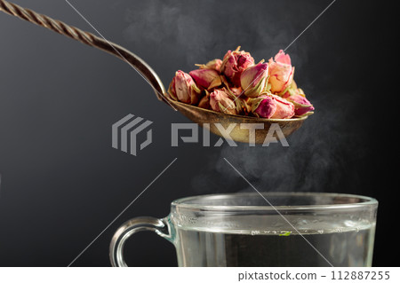 Dried rosebuds for making herbal tea. 112887255
