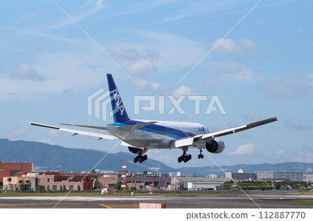 Beautiful takeoff and landing scene of ANA All Nippon Airways at Itami Airport Beautiful takeoff and landing scene of ANA All Nippon Airways at Itami Airport 112887770