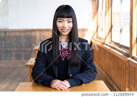 High school girls staying in the school building after school High school girls staying in the school building after school 112889954